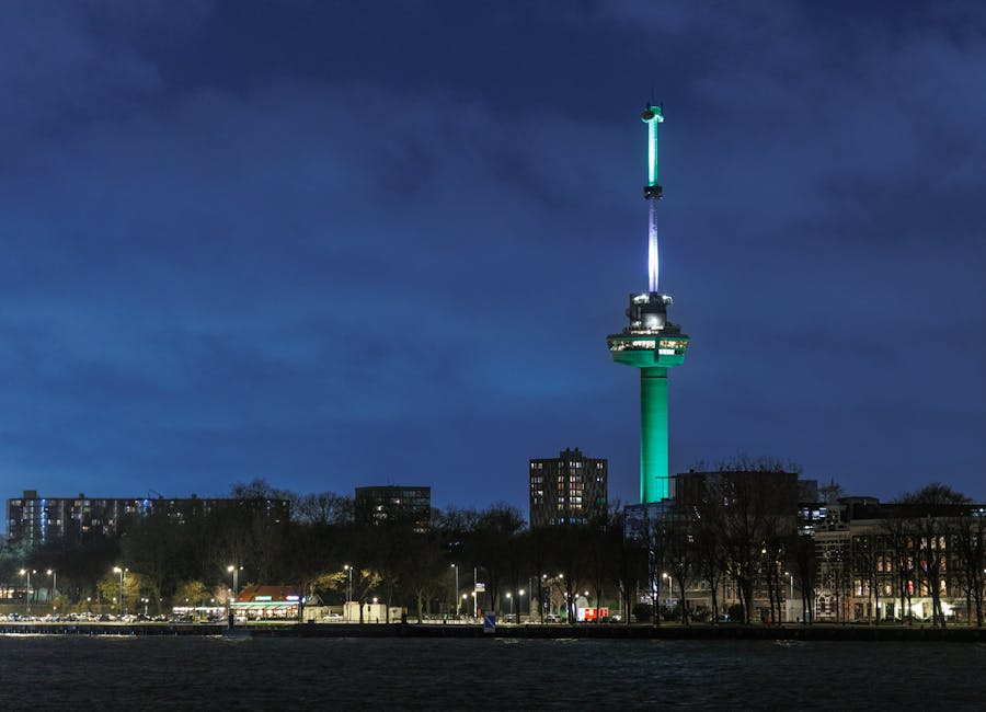 Nighttime view of the iconic Euromast tower in Rotterdam, Netherlands skyline.